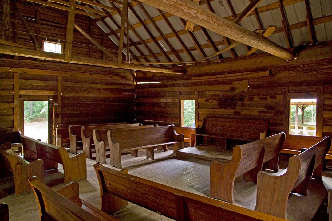 Pews inside arranged in the "hollow square" for Sacred Harp singing.
